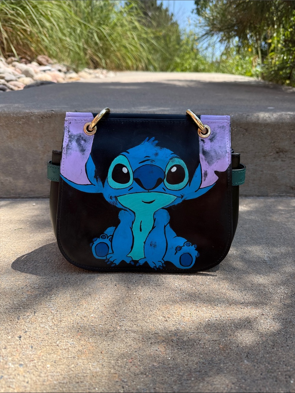 Coach Black Crossbody Bag with Blue Stitch Character and Purple Accents